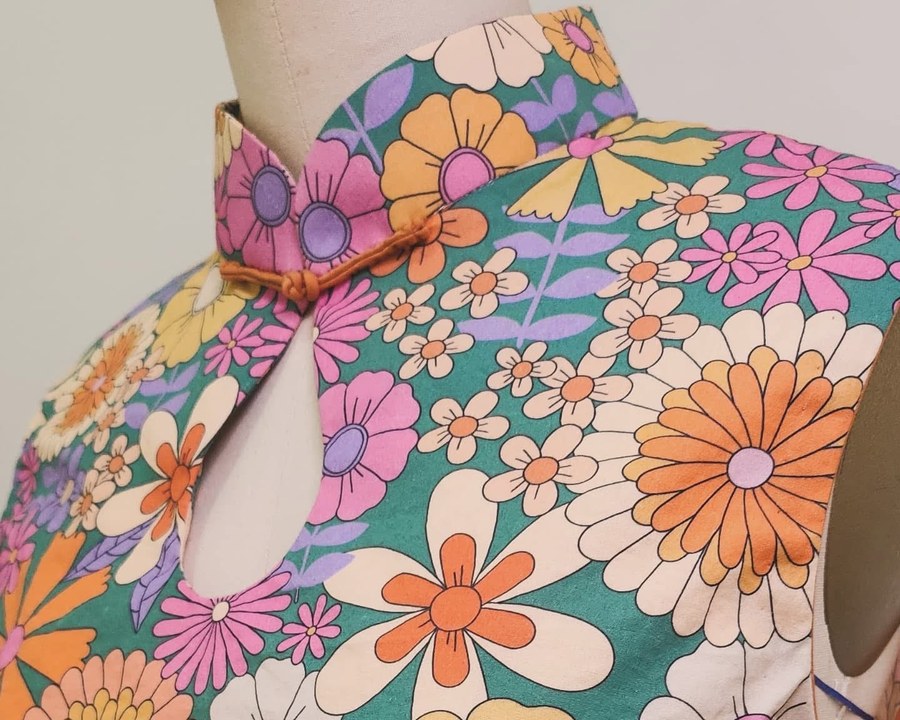 Detail of a bespoke floral garment’s neckline and fabric pattern, one of Bonnie’s pieces